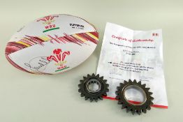 A SIGNED RUGBY UNION BALL BY SAM WARBURTON & TWO FORMULA 1 RACING CAR BAR GEAR RATIO RINGS with