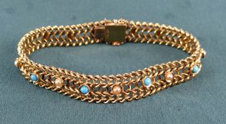 15CT GOLD TURQUOISE & SEED PEARL SET BRACELET of repeating loop design, 24.2gms, in black