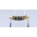 18CT GOLD & PLATINUM THREE STONE DIAMOND RING, claw set, ring size Q, 2.3gms, in green heart