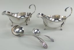 PAIR OF ELECTROPLATED GRAVY BOATS with flying scrolled handles and three-hoof feet, two ladles (4)