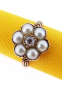 18CT GOLD DIAMOND & PEARL RING of flower head design with central old European cut diamond (0.