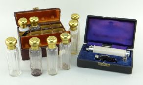 VINTAGE KEELER CASED OPTHALMOSCOPE and a CASED SET OF SIX FRENCH APOTHECARY BOTTLES (2)