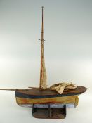 MODEL POND YACHT, with lead keel, on stand, hull 52cms long Condition Report: rigging and boom /