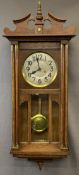 VINTAGE OAK PENDULUM WALL CLOCK having silvered dial set with Roman numerals behind a bevelled