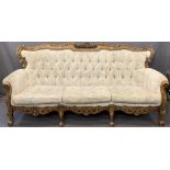 CONTINENTAL CARVED WALNUT THREE SEATER BUTTON BACK UPHOLSTERED SETTEE, 90cms H, 202cms overall W,