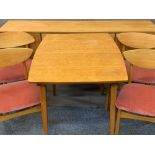 NATHAN TEAK DINING SUITE consisting long sideboard with central three drawers and outer cupboards,