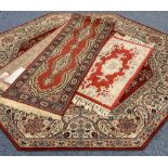 THREE EASTERN STYLE CARPETS all red ground with traditional and floral patterns including an