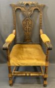 VINTAGE CARVED OAK ARMCHAIR having decorative crest rail and splatback, knurled end arms on turned