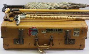 VINTAGE TRAVEL CASE with attached cabin labels, vintage walking sticks and umbrellas