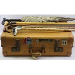 VINTAGE TRAVEL CASE with attached cabin labels, vintage walking sticks and umbrellas