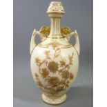 ROYAL WORCESTER BLUSH NARROW NECKED VASE of bulbous form with twin handles and floral decoration,