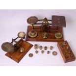 TWO SETS OF SMALL POSTAL SCALES WITH WEIGHTS, 20cms the widest