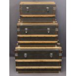 MODERN SET OF THREE VINTAGE STYLE STEAMER TRUNKS, leather effect with wooden banding, 46cms H, 81cms