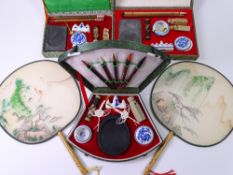 CHINESE CASED CALLIGRAPHY SETS (3) and two Chinese bamboo handled fans