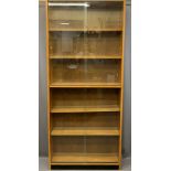 LIGHTWOOD MID-CENTURY TALL GLASS FRONTED BOOKCASE with interior adjustable shelves and four