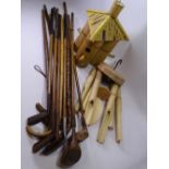 ANTIQUE GOLF CLUBS & STICKS an assortment, also bamboo bird house and wind chimes