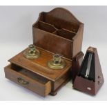 CIRCA 1900 OAK TABLETOP STATIONERY/PEN STAND and a modern mahogany effect metronome, 31cms H,