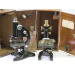 TWO CASED LABORATORY TYPE MICROSCOPES Japanned black in brass and chrome, one marked 'Beck Ltd
