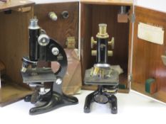 TWO CASED LABORATORY TYPE MICROSCOPES Japanned black in brass and chrome, one marked 'Beck Ltd