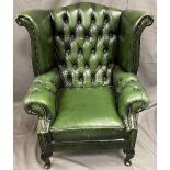 ANTIQUE STYLE GREEN LEATHER EFFECT BUTTON UPHOLSTERED WINGBACK ARMCHAIR, 103cms H, 90cms max W,