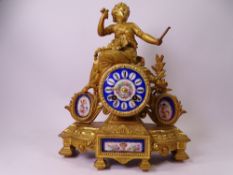 FRENCH MANTEL CLOCK gilt metal with painted enamel dial and porcelain plaques, 32cms H, 26cms W,