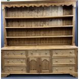 LARGE ANTIQUE STYLE STRIPPED PINE EFFECT DRESSER, the three shelf upper rack with carved detail to