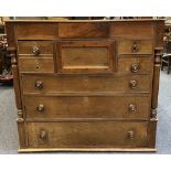 19TH CENTURY OAK CHEST OF 8 DRAWERS, the moulded edge top over a secret central frieze drawer,