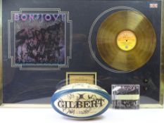 SIGNED MEMORABILIA, TWO ITEMS to include a framed Bon Jovi Limited Edition gold disc 'Slippery