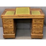 CIRCA 1900 MAHOGANY TWIN PEDESTAL DESK, the top with three section gilt tooled leather inserts,
