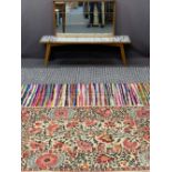 VINTAGE WALL MIRROR, tiled top coffee table and three various woollen rugs, 48 x 84.5cms, 37.5cms H,