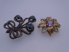 9CT GOLD & STERLING SILVER BROOCHES (2), the gold example flower and leaf form with central Amethyst