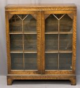 GOOD VINTAGE OAK TWO DOOR GLAZED BOOKCASE with interior adjustable shelves on corner bracket feet,