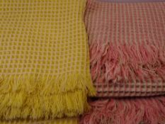 TWO VINTAGE WOOLLEN WAFFLE BLANKETS, one Pink 220 x 152cms, one Yellow 220 x 212cms