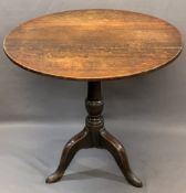 ANTIQUE OAK TILT-TOP TRIPOD TABLE having a 76cms diameter top on a turned column base and three