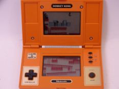 NINTENDO DONKEY KONG GAME & WATCH, multi-screen handheld console (appears working, though no