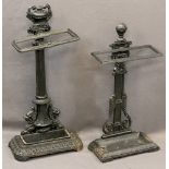 TWO QUALITY REPRODUCTION CAST IRON STICK STANDS including an urn top example on a column stem with