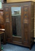 VINTAGE OAK SINGLE MIRRORED DOOR WARDROBE with carved and beaded panel detail, 184.5cms H, 127cms