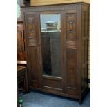 VINTAGE OAK SINGLE MIRRORED DOOR WARDROBE with carved and beaded panel detail, 184.5cms H, 127cms