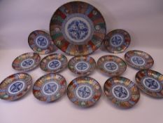 20TH CENTURY JAPANESE IMARI CHARGER & 12 SIDE DISHES SET, typical colourful pallet with underglaze