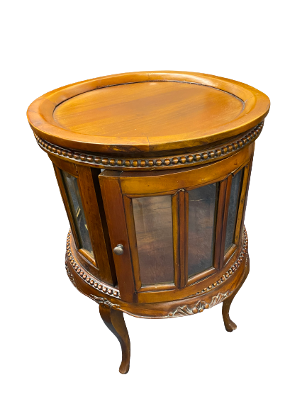 REPRODUCTION HARDWOOD DRUM TYPE DRINKS CABINET having a lift-off circular tray top, beaded and