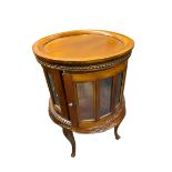 REPRODUCTION HARDWOOD DRUM TYPE DRINKS CABINET having a lift-off circular tray top, beaded and