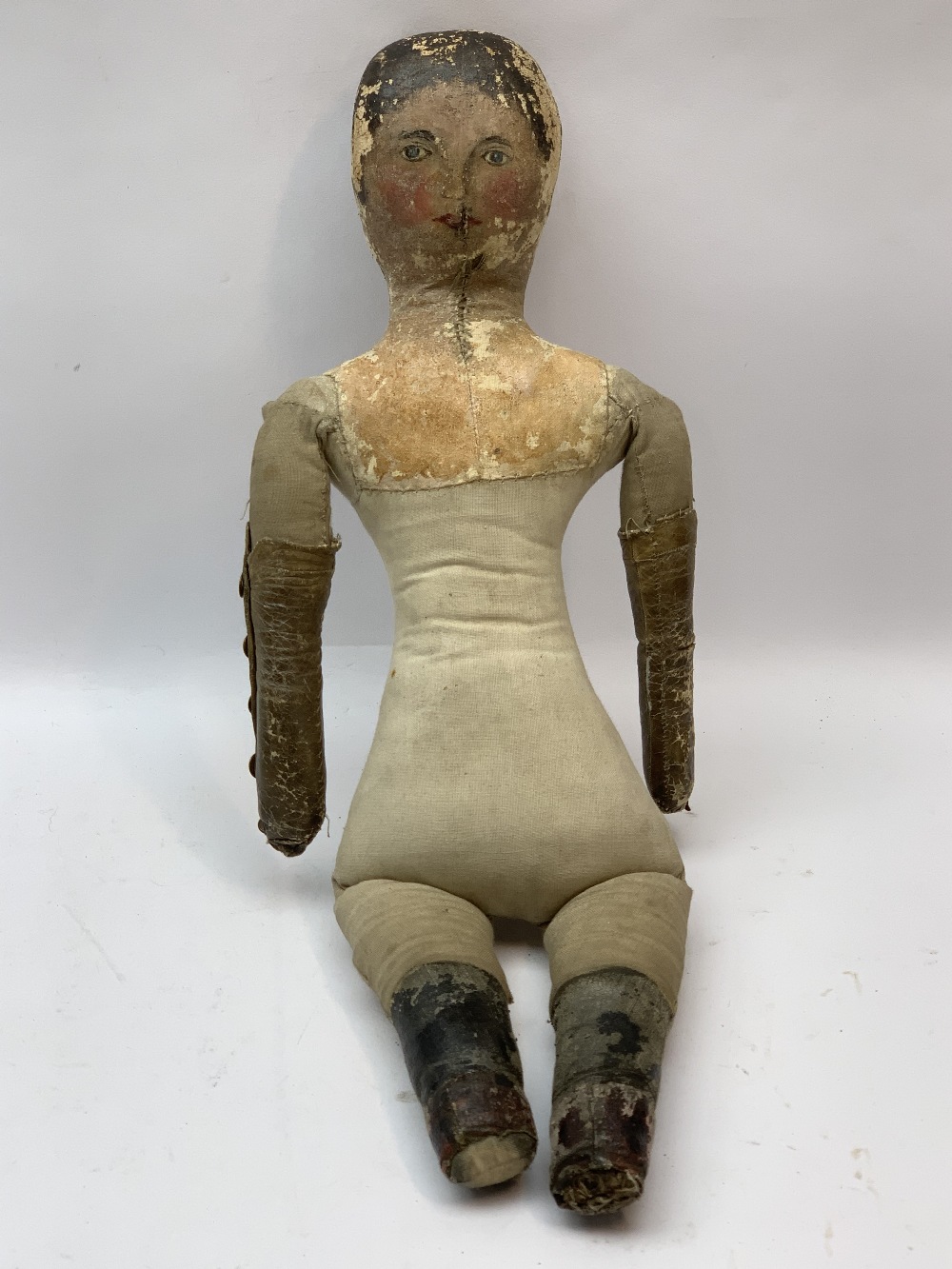 PRIMITIVE AMERICAN FOLK ART DOLL, stitched cloth body and leather limbs with painted hair and facial - Image 6 of 6