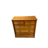 EDWARDIAN MAHOGANY CHEST of two short over three long drawers with stylised acorn drop brass handles