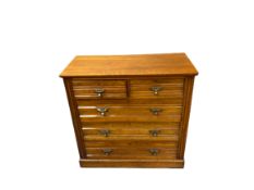 EDWARDIAN MAHOGANY CHEST of two short over three long drawers with stylised acorn drop brass handles