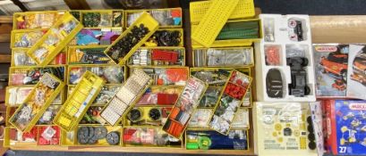 VINTAGE & LATER MECCANO an amassed quantity contained in 39 plastic and tin lidded Meccano boxes