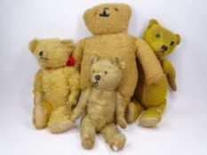 FOUR VINTAGE TEDDY BEARS including mohair with jointed limbs, the small example with interior squeak