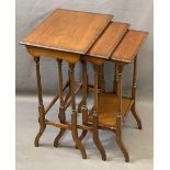 EDWARDIAN MAHOGANY NEST OF THREE OCCASIONAL TABLES with beaded edge detail on turned and splayed