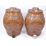 STONEWARE BARRELS, A PAIR, WITH RELIEF COAT OF ARMS & THREE FEATHER DECORATION, 31cms tall (A/F)