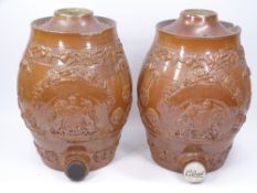 STONEWARE BARRELS, A PAIR, WITH RELIEF COAT OF ARMS & THREE FEATHER DECORATION, 31cms tall (A/F)