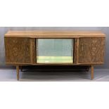 MID-CENTURY BEAUTILITY WALNUT EFFECT SIDEBOARD of central mirrored cabinet with sliding glass